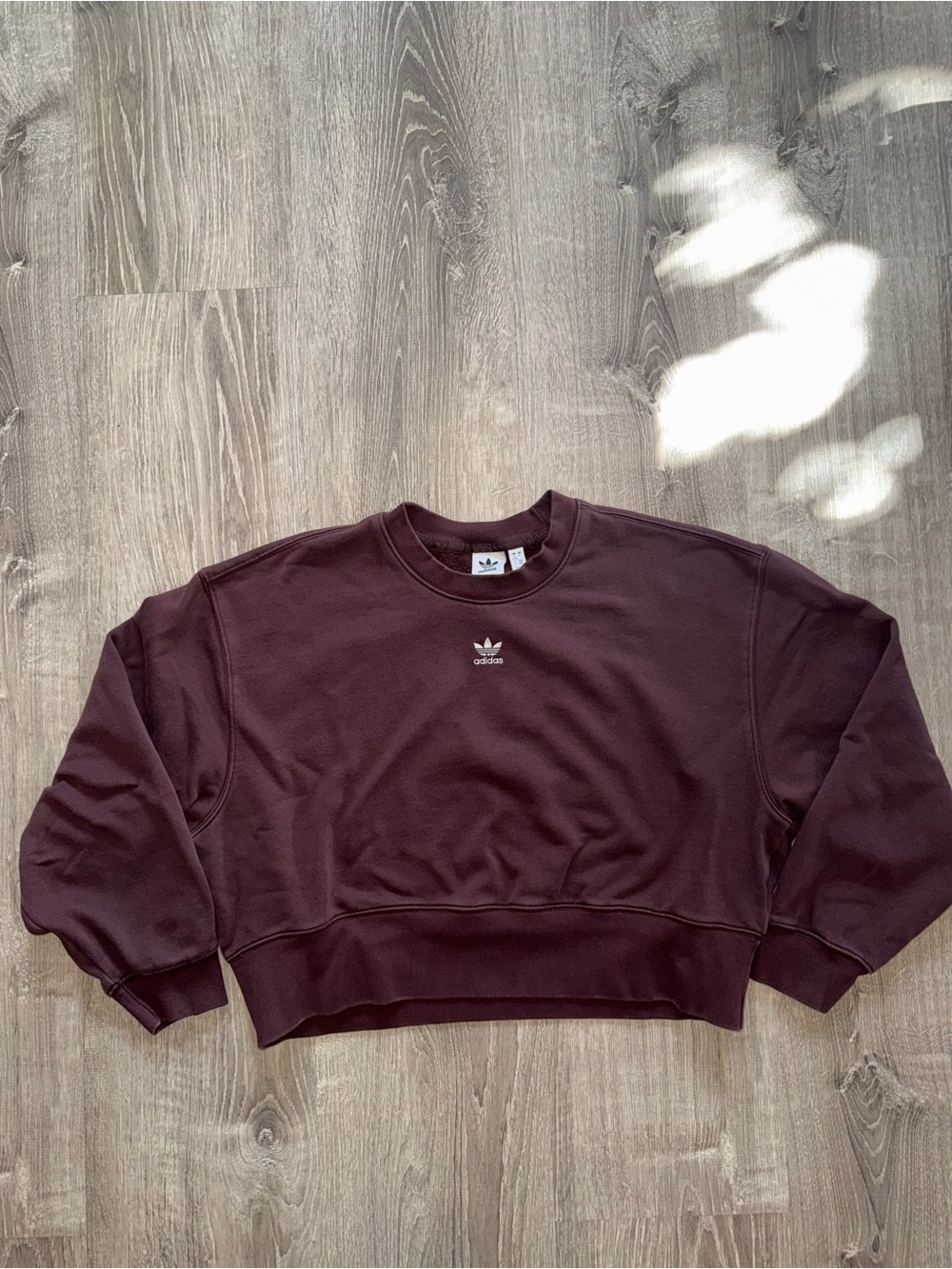 adidas womenโs brown cropped Crewneck Sweatshirt